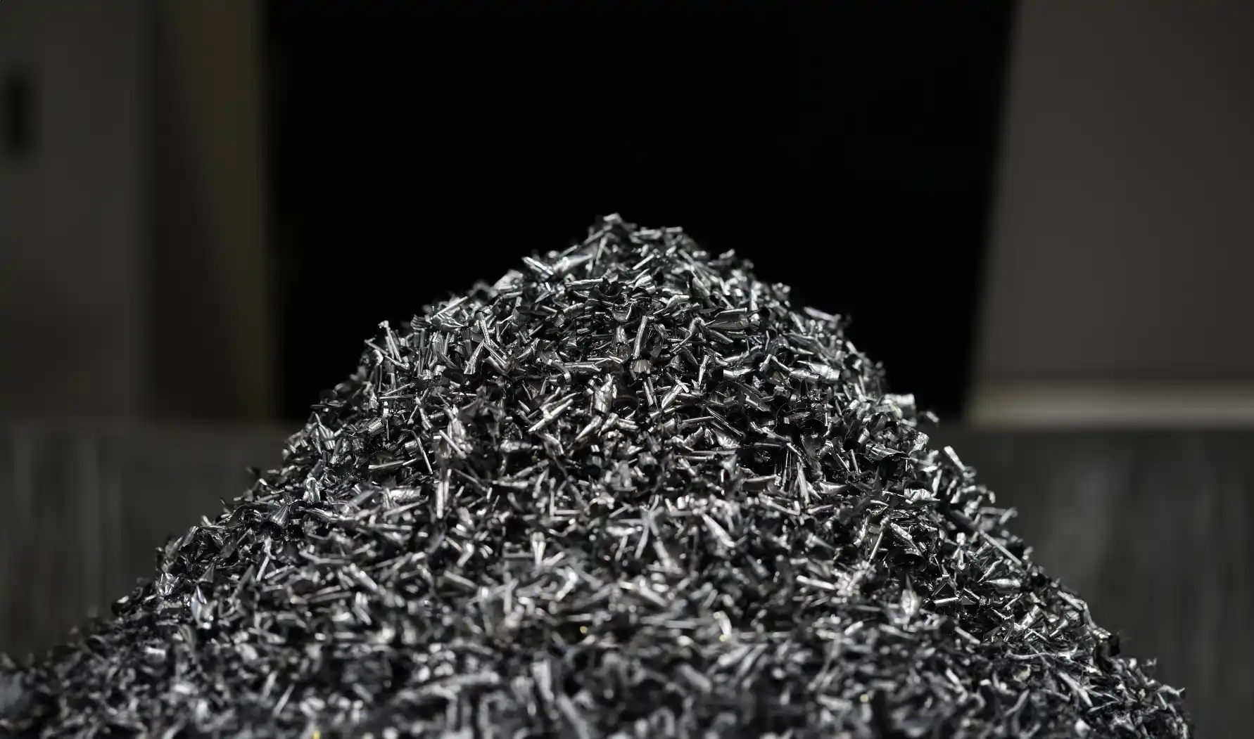 Close-up of mixed scrap iron and steel offcuts before metal sorting